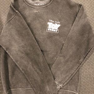 Buzz light year.  Toy Story crew sweatshirt